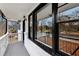 Charming porch with white railing, black trim windows, and painted brick creating a welcoming outdoor space at 5063 White Sw Blvd, Mableton, GA 30126