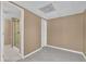Neutral basement space with tile floors and nearby renovated full bathroom with glass shower door at 2020 Stockton Walk Ln, Snellville, GA 30078
