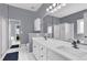 Bathroom with a large double vanity, tiled floors, soaking tub and standing shower at 2020 Stockton Walk Ln, Snellville, GA 30078
