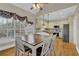 Open concept kitchen and breakfast nook with vaulted ceilings and lots of windows at 2020 Stockton Walk Ln, Snellville, GA 30078