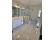 Modern bathroom with a glass-enclosed shower and a double vanity at 7260 Bluewater Ln, Douglasville, GA 30135
