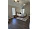 A bedroom featuring a vaulted ceiling, natural light, and neutral decor at 7260 Bluewater Ln, Douglasville, GA 30135
