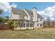 Spacious backyard featuring mature trees, a pergola, a screened-in porch, and a fenced perimeter at 114 Highgrove Pl, Mcdonough, GA 30253