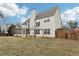 Large backyard featuring a chimney, an enclosed sunroom, a pergola, and a wood fence at 114 Highgrove Pl, Mcdonough, GA 30253
