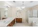 Bathroom featuring a double vanity, soaking tub, and glass enclosed shower at 114 Highgrove Pl, Mcdonough, GA 30253