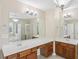 Spacious bathroom with double sinks, large mirrors, and a separate glass door shower and tub at 114 Highgrove Pl, Mcdonough, GA 30253