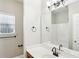 Bathroom featuring a single vanity with a framed mirror and a tub and shower at 114 Highgrove Pl, Mcdonough, GA 30253