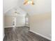 Bedroom with vaulted ceiling, ceiling fan, and wood-look flooring at 114 Highgrove Pl, Mcdonough, GA 30253