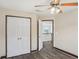 Bedroom with a double door closet and wood grain floors at 114 Highgrove Pl, Mcdonough, GA 30253