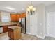 Spacious kitchen featuring modern appliances, hardwood floors, and an island at 114 Highgrove Pl, Mcdonough, GA 30253