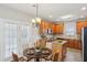 Eat-in kitchen with wood cabinets, stainless steel appliances, and French door access to backyard at 114 Highgrove Pl, Mcdonough, GA 30253