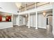 Spacious living area showcasing hardwood floors, an open floorplan, and elegant lighting at 114 Highgrove Pl, Mcdonough, GA 30253