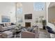 Cozy living room with a fireplace, stylish furniture, and a bright window view at 114 Highgrove Pl, Mcdonough, GA 30253