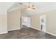 Main bedroom with vaulted ceilings, wood-look flooring, and en-suite bathroom at 114 Highgrove Pl, Mcdonough, GA 30253