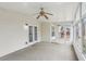 Enclosed sunroom with large windows and french doors at 114 Highgrove Pl, Mcdonough, GA 30253