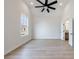 Spacious bedroom with a ceiling fan, a window and an en-suite bathroom at 160 South Village Ave, Holly Springs, GA 30115