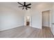 Spacious main bedroom featuring a vaulted ceiling, ceiling fan, and ensuite access at 160 South Village Ave, Holly Springs, GA 30115