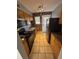 Efficient kitchen with stainless steel appliances, granite countertops, and brick accent wall at 561 Formwalt Sw St # 8, Atlanta, GA 30312