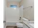Bright bathroom featuring a tiled shower-tub combination and a light-toned vanity countertop at 6120 Gwendoline Dr, Atlanta, GA 30349