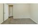 Bedroom showcasing neutral walls, carpet floors, and two doors at 6120 Gwendoline Dr, Atlanta, GA 30349