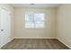 Bedroom showcasing neutral walls, carpet floors, and a window with blinds at 6120 Gwendoline Dr, Atlanta, GA 30349