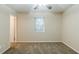 Bedroom showcasing neutral walls, carpet floors, a ceiling fan and a window with blinds at 6120 Gwendoline Dr, Atlanta, GA 30349