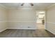 Cozy dining area leads to a kitchen with sleek stainless steel appliances and white cabinets, creating a modern feel at 6120 Gwendoline Dr, Atlanta, GA 30349