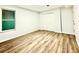 Bedroom features wood-look flooring, fresh paint, and closet at 782 Fox Valley Dr, Stone Mountain, GA 30088