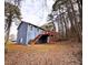 Rear exterior view showing new deck and wooded lot at 782 Fox Valley Dr, Stone Mountain, GA 30088