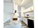 Bright kitchen featuring granite countertops, white cabinetry and updated appliances at 782 Fox Valley Dr, Stone Mountain, GA 30088
