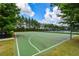 Full-size basketball court in a lush green setting, perfect for sports and recreation at 411 Ridgeway Ln, Canton, GA 30114