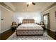 Bedroom with tray ceilings, neutral paint and hardwood floors at 411 Ridgeway Ln, Canton, GA 30114