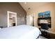 Bedroom featuring a queen bed, desk, and ensuite bathroom in a modern design at 411 Ridgeway Ln, Canton, GA 30114