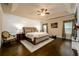 Spacious bedroom with tray ceilings, sitting area and hardwood floors at 411 Ridgeway Ln, Canton, GA 30114