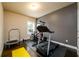 Home gym featuring modern exercise equipment and a dark hardwood floor at 411 Ridgeway Ln, Canton, GA 30114