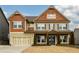 Charming two-story home featuring a two-car garage and a beautifully landscaped front yard at 411 Ridgeway Ln, Canton, GA 30114