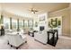Bright living room features a fireplace, built-in shelving, and comfortable seating at 411 Ridgeway Ln, Canton, GA 30114