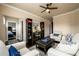 A cozy living room with hardwood floors, neutral furniture, and plenty of natural light at 411 Ridgeway Ln, Canton, GA 30114