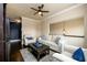 A cozy living room with hardwood floors, neutral furniture, and plenty of natural light at 411 Ridgeway Ln, Canton, GA 30114