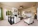 Cozy living room showcases a fireplace and built-in display cabinets with neutral-toned furnishings at 411 Ridgeway Ln, Canton, GA 30114