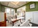 Sunlit living room with coffered ceiling, showcasing a cozy and inviting atmosphere at 411 Ridgeway Ln, Canton, GA 30114
