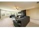 A spacious living room featuring a large sectional sofa, wet bar, and plenty of natural light at 411 Ridgeway Ln, Canton, GA 30114