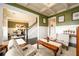 This view of the living room shows its proximity to the dining room and staircase at 411 Ridgeway Ln, Canton, GA 30114