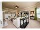 Open-concept living room adjacent to the kitchen, featuring plush seating and a fireplace at 411 Ridgeway Ln, Canton, GA 30114