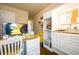 Bright office space with white custom storage, wood countertops and hardwood floors at 411 Ridgeway Ln, Canton, GA 30114
