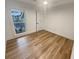 Clean and well-lit bedroom with wood-look floors and a ceiling fan at 4409 Idlewood Ln, Tucker, GA 30084