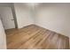 Simple bedroom featuring wood-look floors and ample closet space at 4409 Idlewood Ln, Tucker, GA 30084