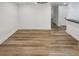 An empty room featuring neutral walls and light wood flooring at 4409 Idlewood Ln, Tucker, GA 30084