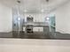 Bright kitchen with stainless steel appliances, white cabinets and dark countertops at 4409 Idlewood Ln, Tucker, GA 30084