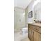 Bathroom with glass enclosed shower, stylish vanity, and neutral color scheme at 578 Brashy Street, Woodstock, GA 30188